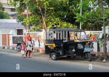 A woman and young child walking through Fort Kochi, Kerala India Stock Photo