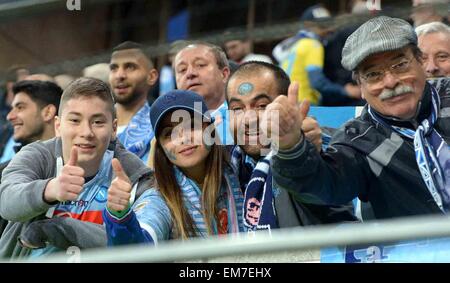 Wolfsburg, Germany. 16th Apr, 2015. Napoli fans sit in the stands at the Europa League quarter finals first-leg match between VfL Wolfsburg and SSC Napoli in the Volkswagen Arena in Wolfsburg, Germany, 16 April 2015. Photo: PETER STEFFEN/dpa/Alamy Live News Stock Photo