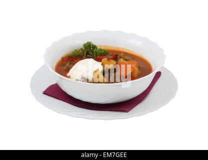 Hungarian soup with vegetables and meat on an isolated background Stock Photo