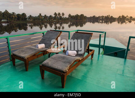 Deck chairs on a deck, luxurious houseboat, Discovery of the boutique hotel chain Malabar Escapes, morning light, backwaters Stock Photo