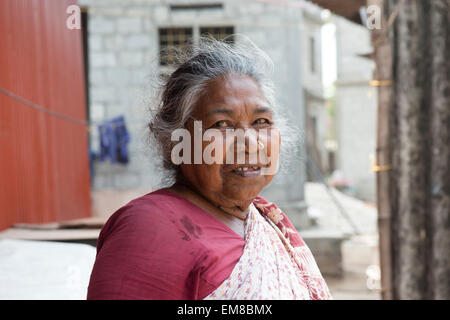 Indian woman smiling for the camera in Fort Kochi, Kerala India Stock Photo