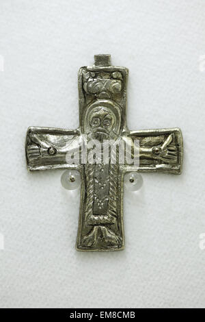 Prague, Czech Republic. 16th April 2015. Great Moravian silver cross with the image of the crucified Christ displayed at the exhibition 'Great Moravia and the Beginnings of Christianity' in Prague, Czech Republic. The cross from the 9th century was discovered in Mikulcice, Czech Republic, the former capital city of the Great Moravian Empire. The exhibition presenting medieval treasures and original artefacts of the first Slavic state runs in Prague Castle till June 28, 2015. Stock Photo