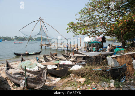 Chinese Fishing nets and fishing boats on the beach in Fort Kochi, Kerala India Stock Photo