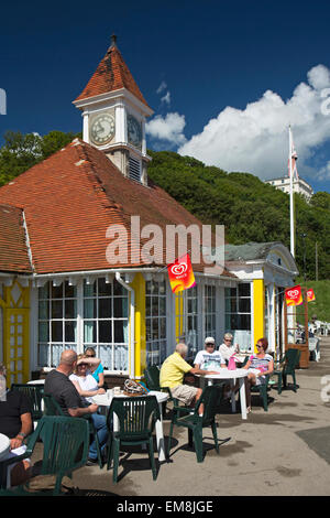 UK, England, Yorkshire, Scarborough, South Cliff, Clock Tower Café, customers sitting outside in sunshine Stock Photo