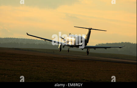 Single turboprop aircraft airplane taking off, shoted on airport ...
