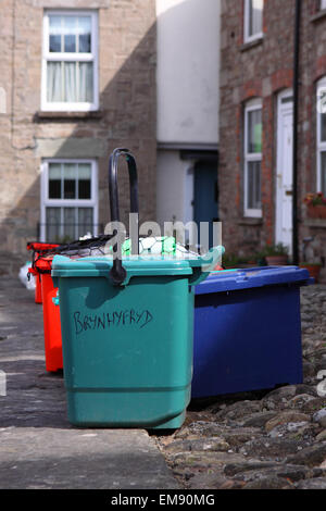 Domestic refuse recycling rubbish bins waiting for collection on dustbin day in Powys Wales Stock Photo