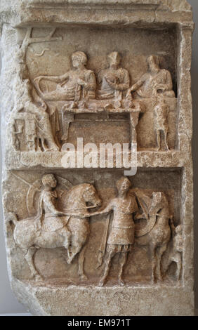 Marble grave relief with a funeray banquet and departing warriors. Greek, Hellenistic period, 2n c. BC. Stock Photo