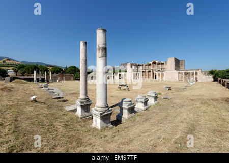 The remaining Palestra colonnade and the marble courtyard hall of the Roman Bath- Gymnasium complex. Sardis, Turkey. The double Stock Photo