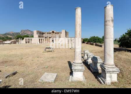 The remaining Palestra colonnade and the marble courtyard hall of the Roman Bath- Gymnasium complex. Sardis, Turkey. The double Stock Photo