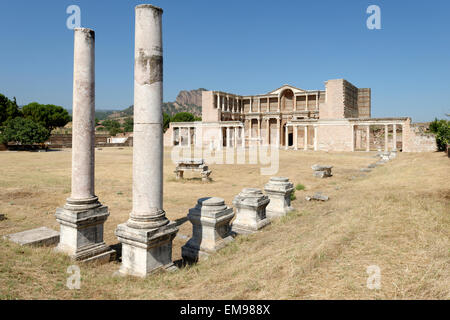 The remaining Palestra colonnade and the marble courtyard hall of the Roman Bath- Gymnasium complex. Sardis, Turkey. The double Stock Photo