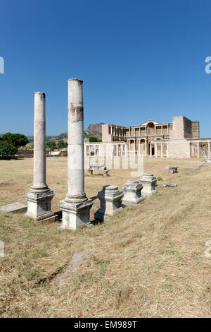 The remaining Palestra colonnade and the marble courtyard hall of the Roman Bath- Gymnasium complex. Sardis, Turkey. The double Stock Photo