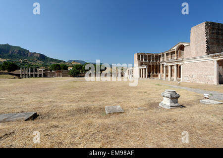 The remaining Palestra colonnade and the marble courtyard hall of the Roman Bath- Gymnasium complex. Sardis, Turkey. The double Stock Photo