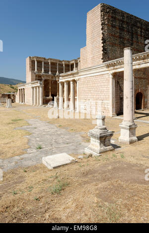 The remaining Palestra colonnade and the marble courtyard hall of the Roman Bath- Gymnasium complex. Sardis, Turkey. The double Stock Photo