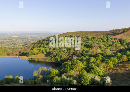 View of British Camp reservoir overlooking severn valley towards the Cotswolds outlying hills Stock Photo