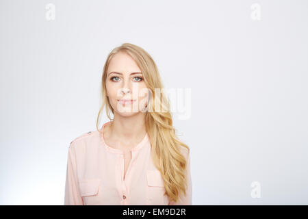 woman is standing with a rose blouse. isolated on white Stock Photo