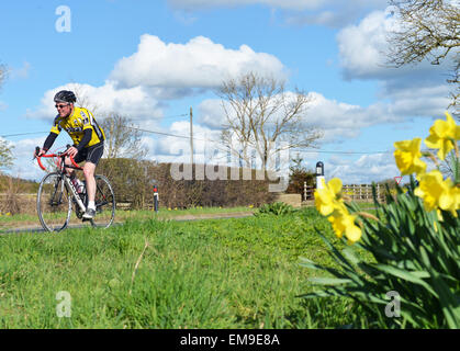 Ingleton, Teesdale, Co. Durham, UK. UK weather. A cyclist making the most of the warm and sunny Spring weather in Teesdale. Further warm weather and sunshine is expected on Saturday for the region. Credit:  Robert Smith/Alamy Live News Stock Photo