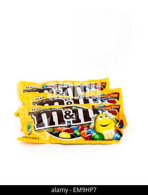 Three M&M chocolate candy packages on a white background. USA. Stock Photo