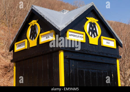 Old fashioned AA box in yellow and black livery, on the A708 next to the Yarrow Water river, Moffat, Dumfries and Galloway, Scot Stock Photo
