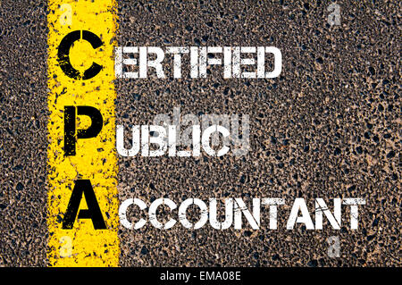 Business Acronym CPA – Certified Public Accountant Yellow paint line on the road against asphalt background. Conceptual image Stock Photo