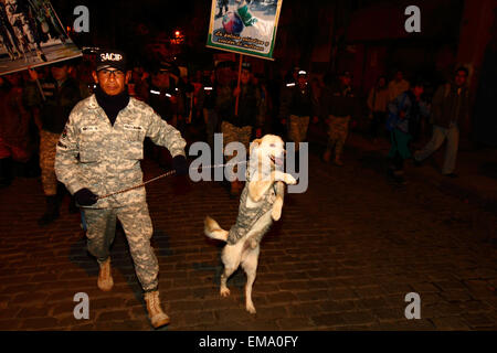 La Paz, Bolivia, 17th April 2015. A police dog handler and his dog take part in a march to demand the government passes laws to protect animals from abuse, and to increase punishments for those found guilty of cruelty towards animals. Credit:  James Brunker / Alamy Live News Stock Photo