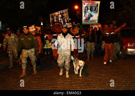 La Paz, Bolivia, 17th April 2015. Police dog handlers take part in a march to demand the government passes laws to protect animals from abuse, and to increase punishments for those found guilty of cruelty towards animals. Credit:  James Brunker / Alamy Live News Stock Photo
