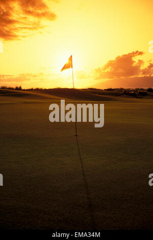 Hawaii, Maui, Kapalua Golf Club Plantation Course, 4Th Hole Flag At Sunset Stock Photo