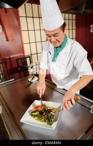 Client Cooking Cook serves dish to a client Stock Photo - Alamy