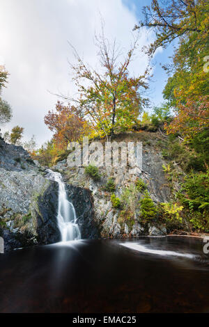 Waterfall in a canyon in the High Fens, Ardennes, Belgium with rotating vortex, long exposure shot Stock Photo