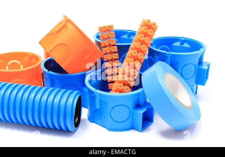 Orange and blue electrical boxes with components for use in electrical installations, accessories for engineering jobs Stock Photo