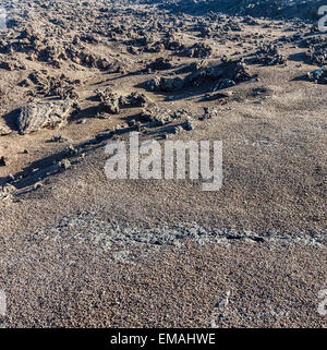 volcanic stone formations in Timanfaya National Park in Lanzarote, Spain with cracked rocks Stock Photo