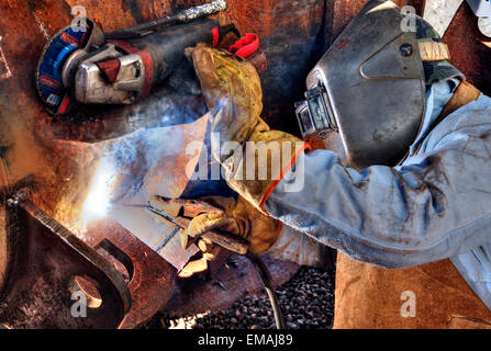 Welding workers at Demarchi Island Port, River Plate  Coast. Buenos Aires, Argentina Stock Photo