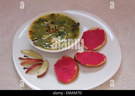 appetizing, healthy spicy hot vegetarian soup with toast spread pink horseradish Stock Photo