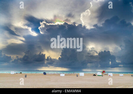 light refractions in the dark clouds at south beach in Miami Stock Photo