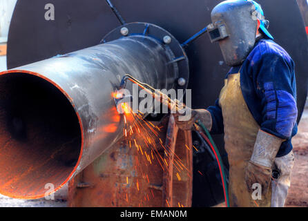 Welding workers at Demarchi Island Port, River Plate  Coast. Buenos Aires, Argentina Stock Photo