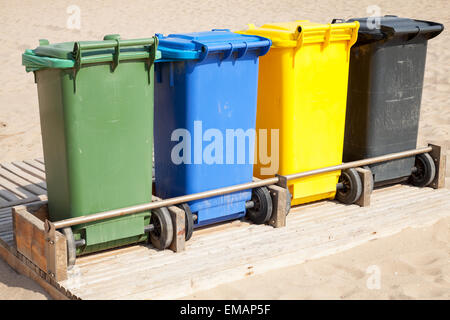 Colorful plastic containers in a row for separate garbage collection Stock Photo