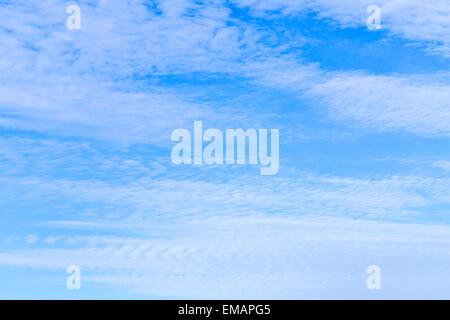 blue sky with small puffy clouds gives a harmonic background Stock Photo