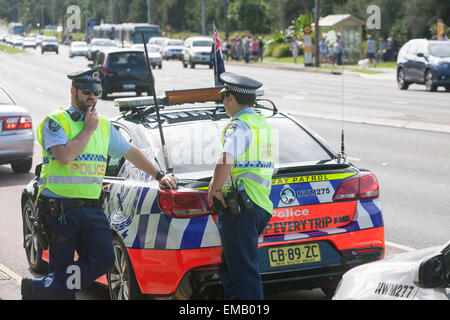 Sydney,Australia. 19th April, 2015. ANZAC commemorative and centenary march along pittwater road Warriewood to celebrate 100 years of  ANZAC, Sydney policemen with police car monitor activities, ( australian and new zealand army corps) alamy live news Credit:  martin berry/Alamy Live News Stock Photo