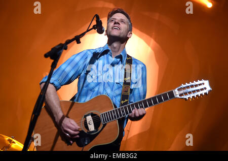 Berlin, Germany. 18th Apr, 2015. US singer Joey Burns of the band Calexico performs on stage at the 'Heimathafen Neukoelln' concert venue in Berlin, Germany, 18 April 2015. Photo: Britta Pedersen/dpa/Alamy Live News Stock Photo