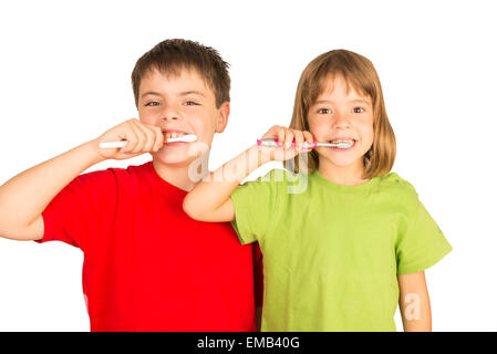 Portrait of a little girl and a young boy brushing teeth Stock Photo