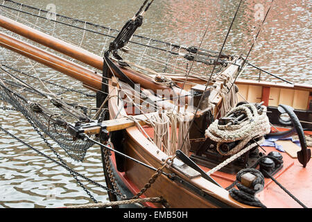 Ropes and anchor on deck of an old sailing boat Stock Photo