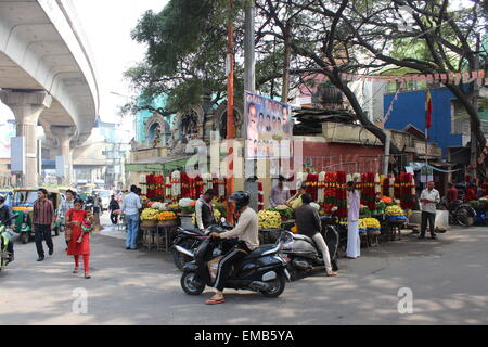 The city of Bengaluru, formerly known as Bangalore, in central southern India. Busy corner beneath MG road  Metro Stock Photo