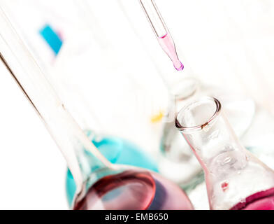 drop falls from the pipette in a flask on a light background Stock Photo