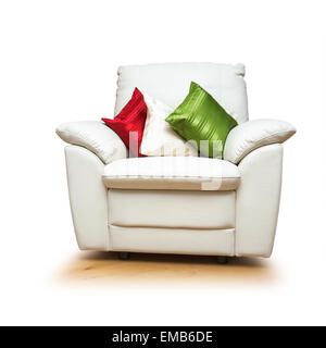 White armchair with colorful pillows isolated on white background. Object with clipping path Stock Photo
