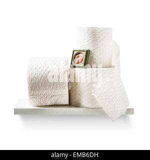 Toilet paper rolls on shelf isolated on white background. Bathroom cabinet. Object with clipping path Stock Photo