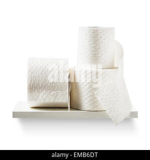 Toilet paper rolls on shelf isolated on white background. Bathroom cabinet. Objects group with clipping path Stock Photo