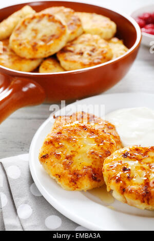 Pancakes with sour cream on a plate, food Stock Photo