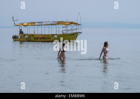 Two young women walking in the sea Stock Photo