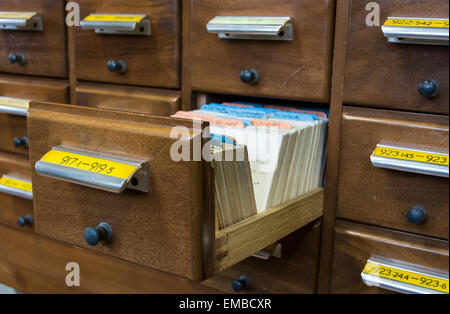 Old fashioned library card catalogue drawer pulled out at the Central Library in Bristol Stock Photo