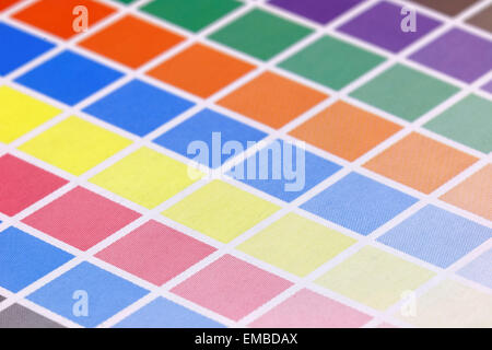 Close-up of a a cmyk test print with many color squares from above ...