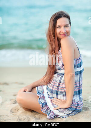 Beautiful pregnant woman on the beach Stock Photo